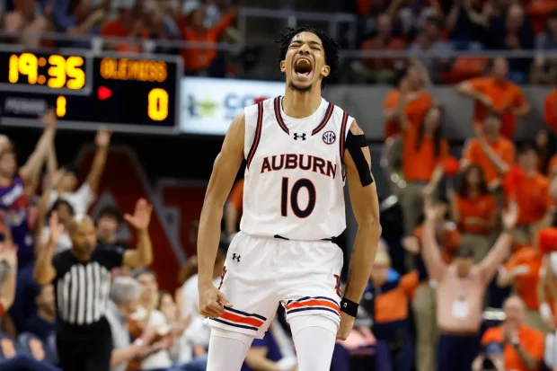 Auburn guard Chad Baker-Mazara reacts after making a three pointer against Mississippi during the first half of an NCAA college basketball game, Wednesday, Feb. 26, 2025, in Auburn, Ala. (AP Photo/Butch Dill)